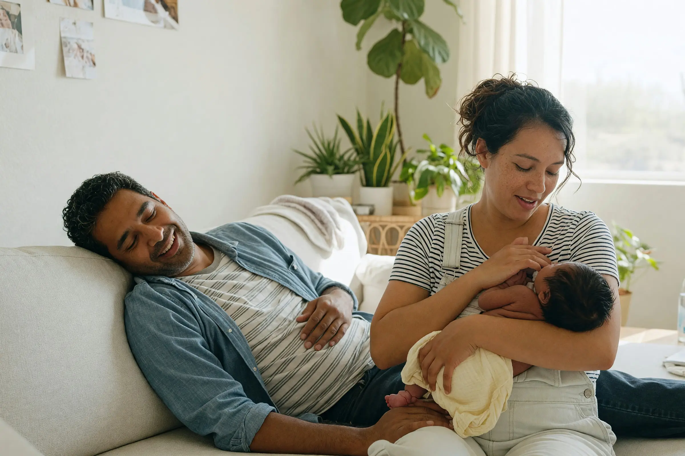 New parents at home with their newborn